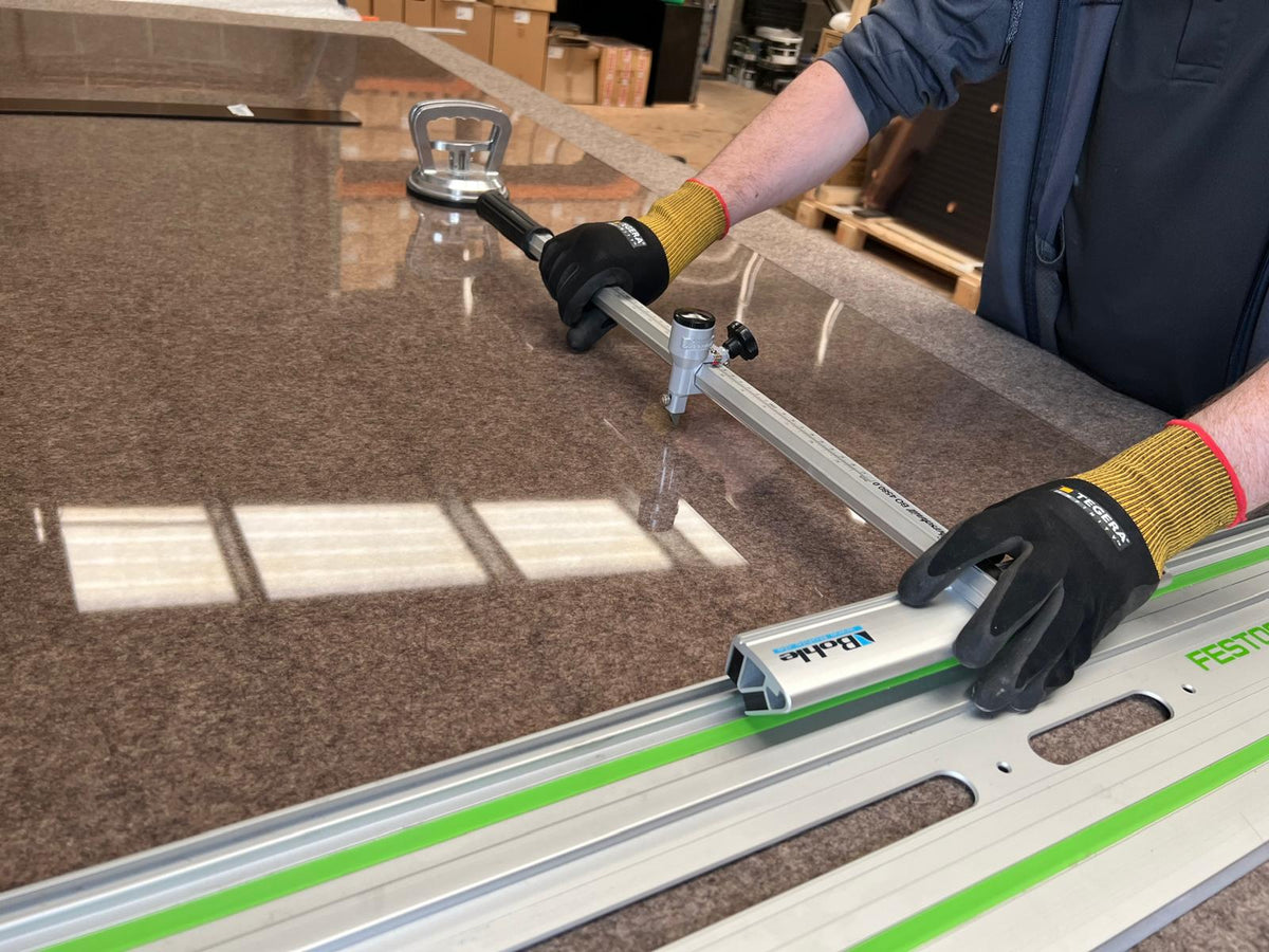 Stove glass being measured at the Newtownards workshop